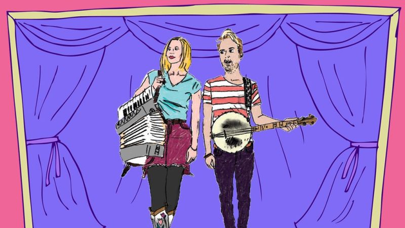 An illustration of two musicians on stage: one holding an accordion and wearing cowboy boots, the other holding a banjo, both standing in front of purple curtains with a pink border. An illustration of two musicians on stage: one holding an accordion and wearing cowboy boots, the other holding a banjo, both standing in front of purple curtains with a pink border.