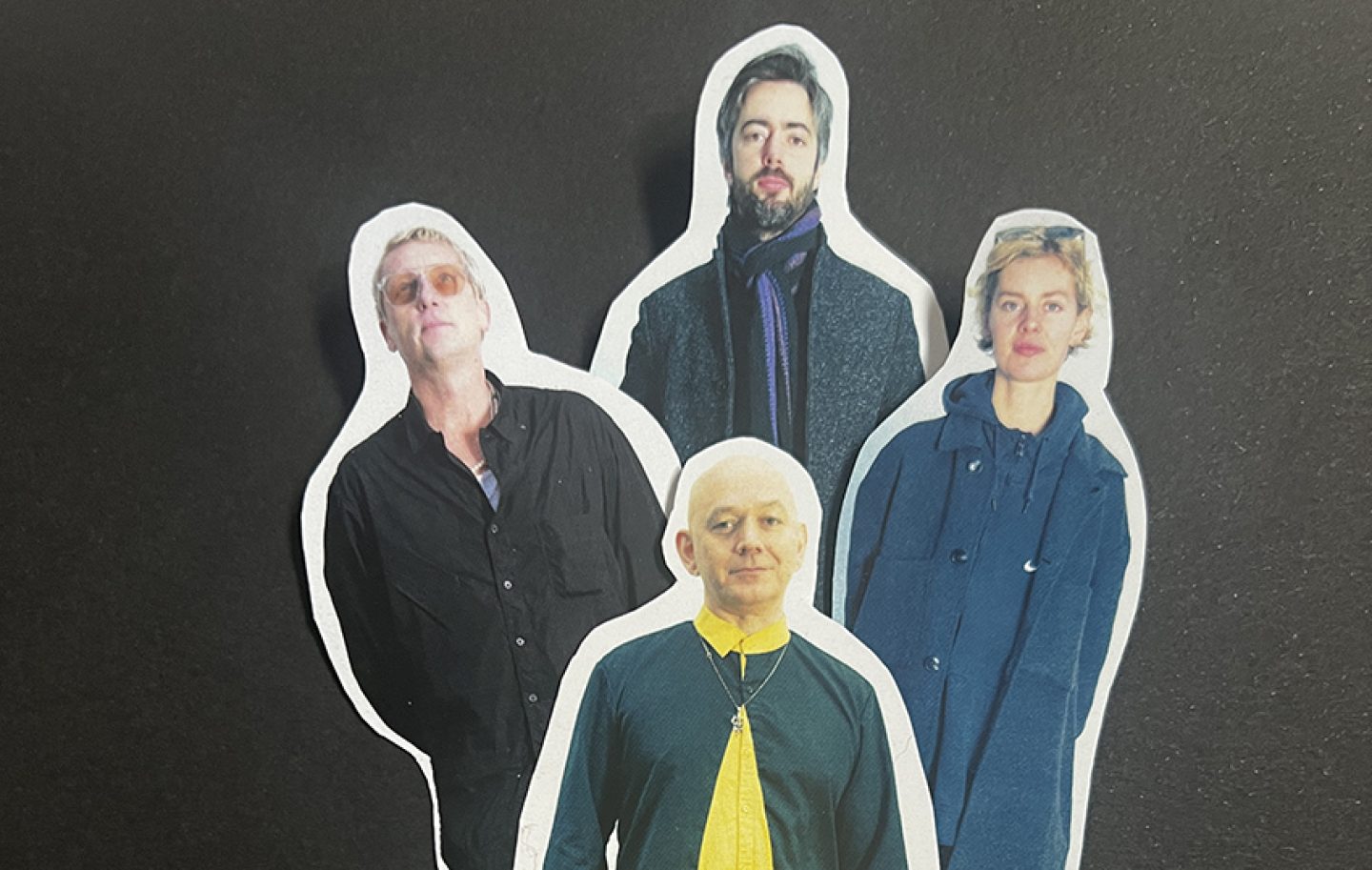 The upper half of pictures of four people on cut out paper. The upper half of pictures of four people on cut out paper.