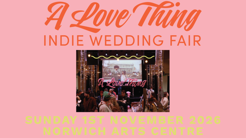 Promotional poster for “A Love Thing Indie Wedding Fair.” The design has a pale pink background with large orange script text reading “A Love Thing” and orange block text reading “INDIE WEDDING FAIR.” In the center is a photograph of a busy indoor event space with people browsing stalls beneath a stage display that says “A Love Thing.” At the bottom, large light-yellow text reads: “SUNDAY 1ST NOVEMBER 2026,” followed by “NORWICH ARTS CENTRE.” Below that is “ALOVETHINGWEDDING.COM” and the tagline “your day ~ your way.”